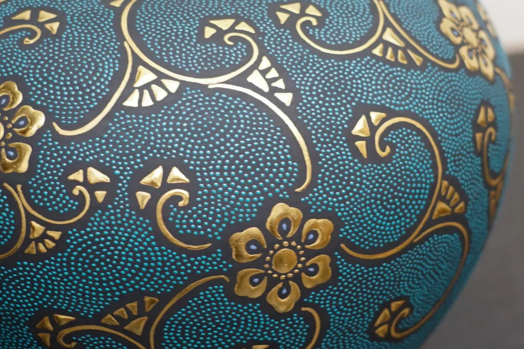 The aochibu technique features precisely aligned dots that, while orderly, create the impression of swirling patterns.