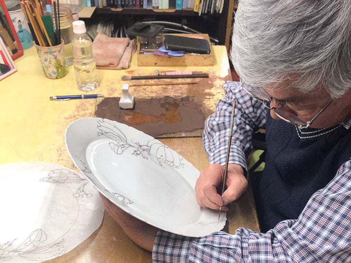 Mr. Yamada's delicate hand paints the picture.