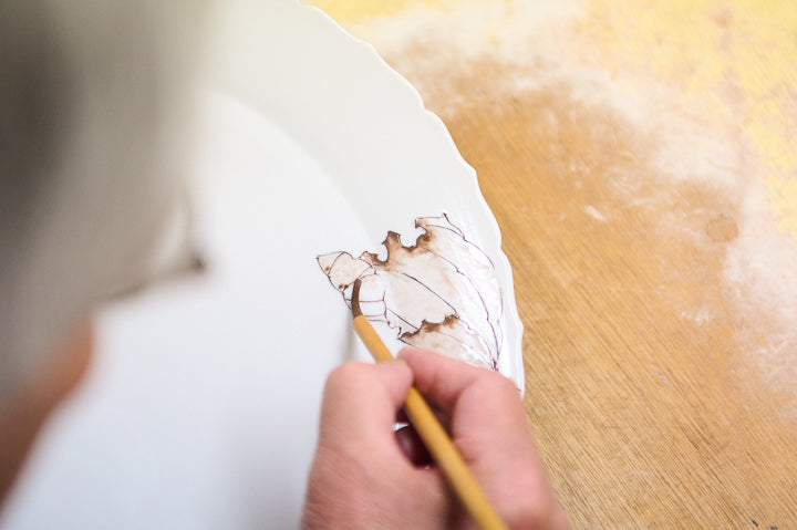 Mr. Yamada's delicate hand paints the picture.